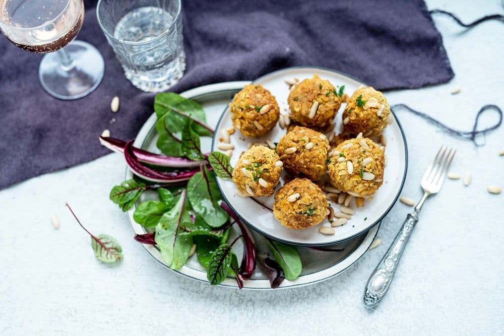 Crispy bread balls with Parmigiano Reggiano and pine nuts